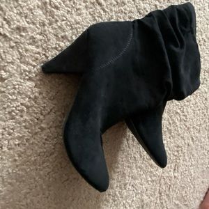 Black healed pointed toe boot heals